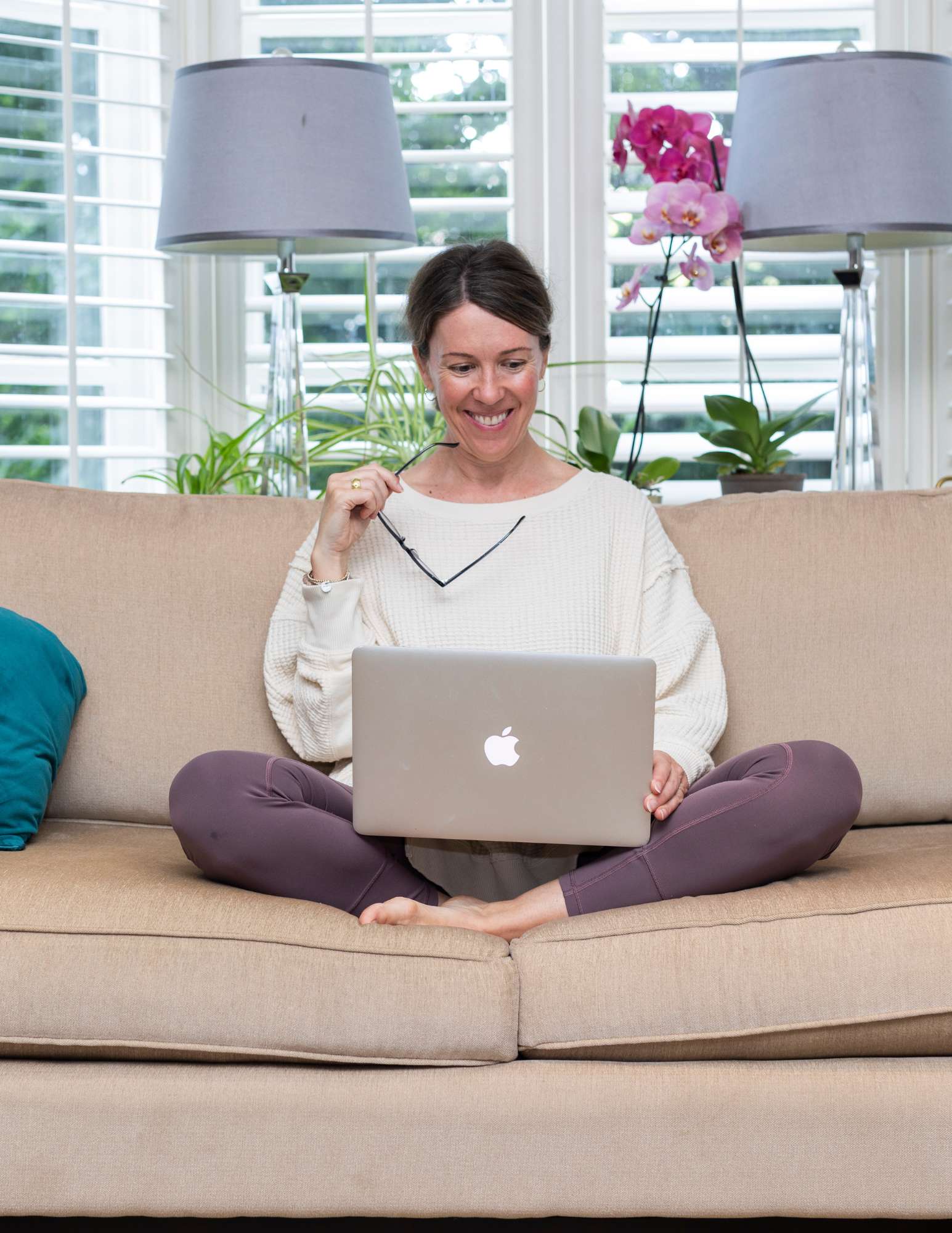 Dana Chapman - Womens Circle on Zoom Laptop on Couch